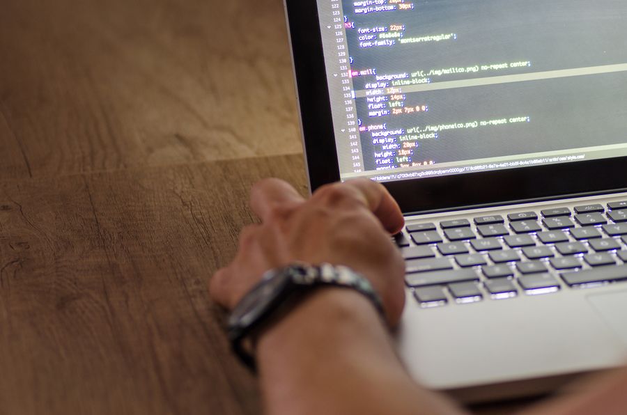 software developer coding laptop